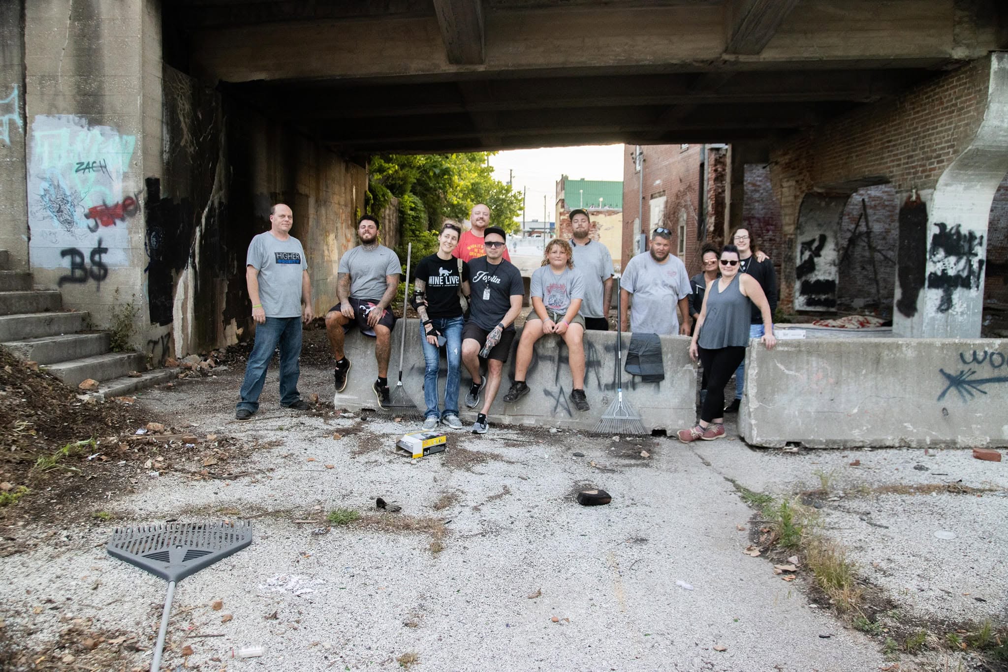 A Joplin cleanup crew gathered in a worn local space after working together