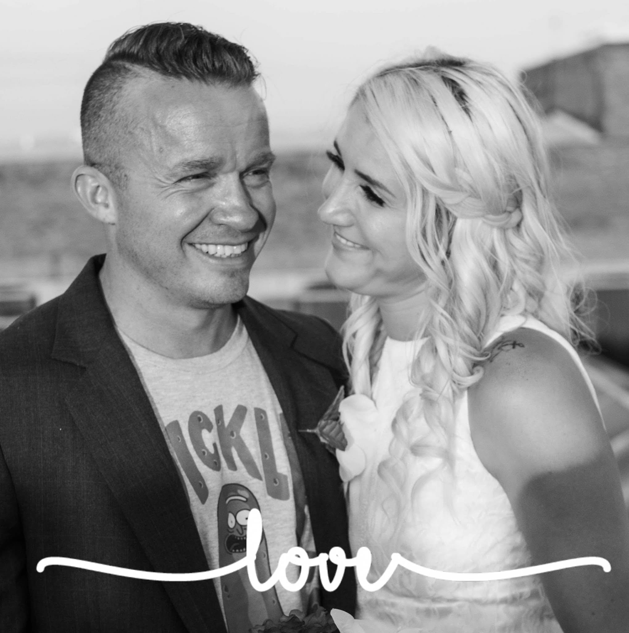 Jon Thomas Buck smiling as his wife, Tiffany Nicole Buck, looks at him