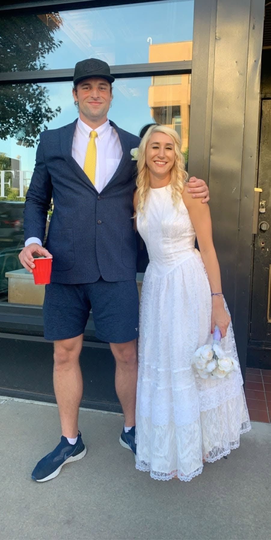 Jon Thomas Buck standing with his wife, Tiffany Nicole Buck, on their wedding day